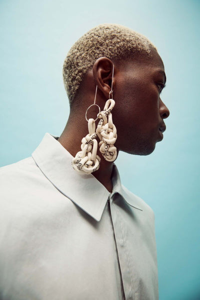 A person modeling unique headwear made in the program.